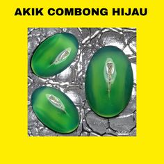 three green objects sitting on top of a yellow background with the words akk combong hijau