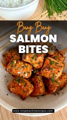 salmon bites in a bowl with chopsticks on the side and rice behind it