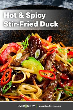 stir fry with beef, peppers and noodles in a skillet text overlay reads hot & spicy stir - fried duck