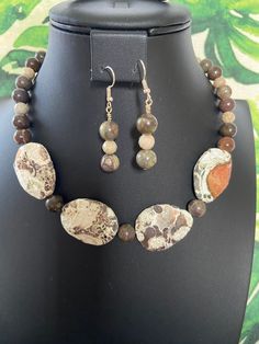 You will receive an unbelievably beautiful, genuine, ocean jasper beaded necklace with matching earrings. This necklace is strung entirely with ocean jasper focal beads. The faceted focal beads have wonderful grayish-brown, beige and peach markings and patterns.  They measure 1 1/2" x 1" at their longest and widest, and are two-sided.  I have shown both sides in the pics provided.  No joke! This very natural-looking necklace is gorgeous This stunning, eye-catcher makes quite a statement! It has Earthy Ocean Jasper Jewelry With Natural Stones, Earthy Jasper Gemstone Beads Jewelry, Earthy Jasper Hand-strung Jewelry, Earthy Jasper Round Bead Jewelry, Moss Agate Jewelry With Natural Stones, Nature-inspired Jasper Gemstone Beads Jewelry, Wooden Bead Jewelry, Ocean Jasper Necklace, Diy Necklaces