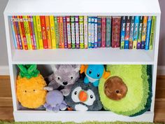 a book shelf filled with lots of books and stuffed animals