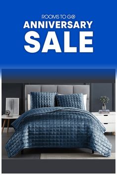 a bed with blue sheets and pillows on it is featured in an ad for the room to go anniversary sale