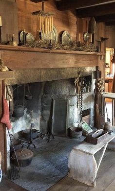 an old fireplace with many items on it