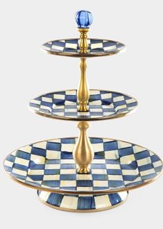 three tiered tray with blue and white checkerboard design