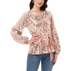 Step into the holiday season with style in the Anna-Kaci Women's Sequin Party Tie Waist Sweatshirt Pullover Top. This bedazzled pullover sweater features glittery sequins from top to bottom, combining festive sparkle with cozy comfort. With its round neckline, cuffed long sleeves, and relaxed fit, it's perfect for adding a touch of glamour to your winter wardrobe. Winter Crew Neck Tops For Night Out, Glamorous Long Sleeve Winter Top, Fall Party Blouse With Crew Neck, Winter Party Sweater With Long Sleeves, Winter Long Sleeve Sequin Top, Glamorous Crew Neck Tops For Night Out, Chic Sequined Tops For Holidays, Fall Party Long Sleeve Crew Neck Top, Chic Holiday Sequined Tops