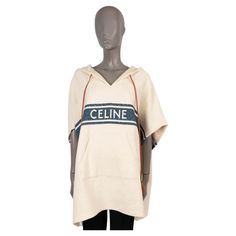 100% authentic Celine Baja cape poncho in cream and navy cotton (91%) and polyamide (9%). The design features a hood, a faux drawstring in cognac brown leather with tassels and kangaroo pocket on the front. Has been worn once or twice and is in virtually new condition. 2021 Spring/Summer Measurements Tag Size 38 Size S Shoulder Width 176cm (68.6in) Bust From 170cm (66.3in) Waist From 170cm (66.3in) Length 86cm (33.5in) Side Seam Length 26cm (10.1in) All our listings include only the listed item Poncho Jacket, Poncho Cape, Primavera Estate, Kangaroo Pocket, Brown Leather, Cape, Fashion Outfits, Couture, Navy