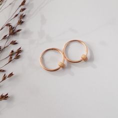 Simple and dainty gold hoop earrings, 14k Gold filled, Trend now, christmas gift for her  Modern, timeless and beautiful!  Our 14ct gold filled hoops are a minimal classic.  So light and comfortable that you could wear it all day!  When running, showering, sleeping, playing and creating, they do not have to be discarded!  You own yourself as a wonderful everyday companion.  Materials:  1 pair of earrings  14mm diameter  14k gold filled  2 sparkling pearls  Stardust, flat, dented  4mm diameter  1 Dainty Rose Gold Tarnish-resistant Huggie Earrings, Rose Gold Tarnish-resistant Dainty Huggie Earrings, 14k Gold Filled Gold Cartilage Earrings, Hypoallergenic Rose Gold 14k Hoop Earrings, Hypoallergenic Rose Gold Hoop Earrings In 14k Gold, Hypoallergenic 14k Rose Gold Hoop Earrings, Rose Gold 14k Huggie Earrings As Gift, 14k Rose Gold Huggie Earrings As Gift, 14k Rose Gold Huggie Earrings For Gift