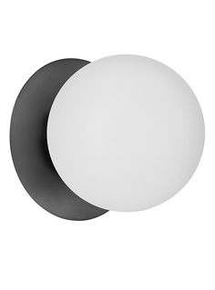 two black and white circular lights against a white background