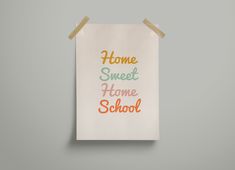 a piece of paper with the words home sweet home school on it hanging on a wall