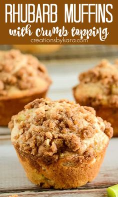 several muffins with crumbled toppings sitting on a table next to a green pickle