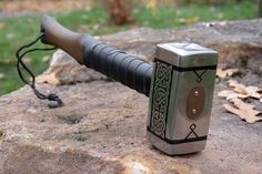 an old style lighter sitting on top of a rock