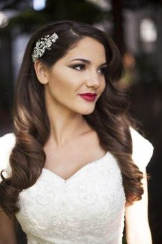 a woman with long hair wearing a wedding dress