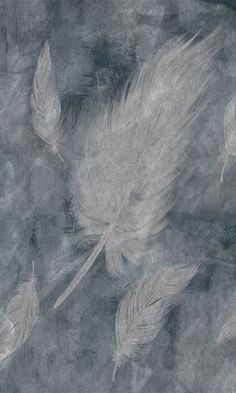 some white feathers flying in the air on a gray background with black and white colors