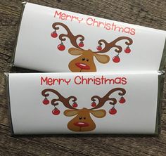 two christmas candy bars with reindeer faces on them