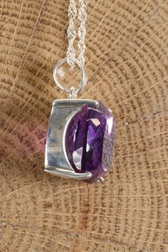 Faceted Amethyst Pendant Approx. Dimensions: 21x24x14 mm This pendant is made with .925 Sterling Silver. Chain is not included. Amethyst is a purple variety of quartz, known for its distinct violet to deep purple hues. It is found in various locations globally, including Brazil, Uruguay, and Zambia. Historically, amethyst has been highly prized for its regal color, and it has been used in jewelry and artifacts by various ancient civilizations, including the Greeks and Egyptians. Composed of sili Purple Sterling Silver Necklace With Polished Finish, Purple Necklace With Polished Finish As Gift, Purple Square Pendant Jewelry For Gift, Amethyst Pendant With Polished Finish, Purple Amethyst Oval Pendant Jewelry, Purple Sterling Silver Necklace With Large Pendant, Amethyst Pendant With Large Stone, Purple Pendant Jewelry With Large Stone, The Greeks