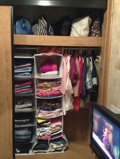 the closet is full of clothes and t - shirts