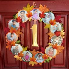 a wreath with pictures of babies and leaves hanging on the front door to celebrate their first birthday