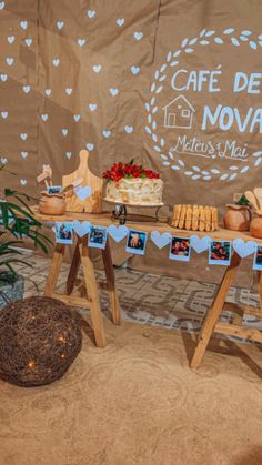 a table topped with cakes and pastries next to a sign that says cafe de nouve