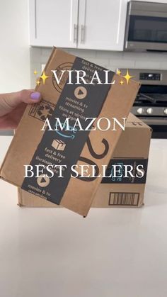 a person holding up a box with the words virtual amazon best sellers written on it