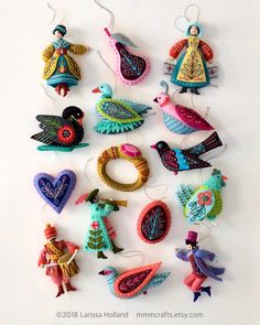 an assortment of colorful ornaments hanging from strings