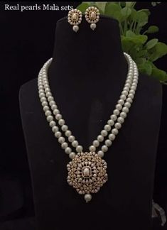 Gorgeous Long CZ Stones Necklace with Pearl in Victorian style with matching earrings Necklace length: 22 inches approx  Highest quality and craftsmanship Free shipping Since natural semiprecious beads are used in this necklace, Color and shape of the beads may vary slightly Please let me know if you have any questions Cheap Traditional Long Necklace, Luxury Long Temple Necklace For Gift, Luxury Dual-tone Temple Jewelry Necklaces, Luxury Temple Necklace With Polished Beads For Wedding, Luxury Vintage Temple Necklace For Ceremonial Occasions, Luxury Dual-tone Temple Necklace, Luxury Antique Temple Necklace For Ceremonies, Luxury Silver Temple Necklace, Pearl Necklace Designs Unique