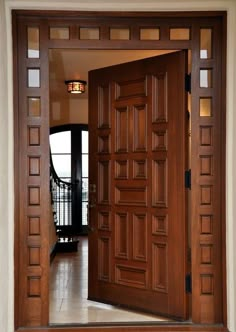 an open wooden door leading to a balcony