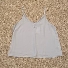 From The Brand Lush, This Baby Bluish Grey Strappy Tank With Key Hole Top Style Is Perfect For Your Next Night Out. Adjustable Straps, 100% Polyester. Size Large. Tags Attached! Bluish Gray, Key Hole, Blue Gray, Blue Grey, Lush, Top Styles, Night Out, Adjustable Straps, Womens Tops