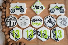 decorated cookies are arranged on a wooden board with the numbers 13, 13, and 13