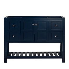 a dark blue cabinet with drawers and shelves