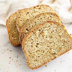 three slices of bread sitting on top of a white counter