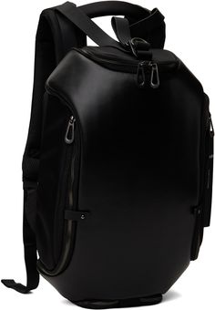 Expandable grained leather and taffeta backpack in black. · Carry handle · Adjustable padded shoulder straps · Cinch strap with D-ring at top · Drawstring at throat · Post-stud tabs at face · Zip expansion panel at face · Zip pocket at sides and base · Logo flag at side · Two-way zip closure at back face · Patch pockets at interior · Padded laptop compartment · Logo-engraved silver-tone hardware · H19 x W12 x D6 / 12 L · Expanded: 26 L Supplier color: Agate black Black Bags With Leather Backing For Commuting, Commuting Black Bag With Leather Backing, Black Leather Backpack With Leather Trim For Travel, Black Commuting Bag With Leather Backing, Black Leather Backpack With Detachable Strap For Business, Black Backpack With Leather Trim For Travel, Black Bag With Adjustable Straps For Commuting, Black Commuting Bag With Adjustable Straps, Black Commuter Bag With Adjustable Straps