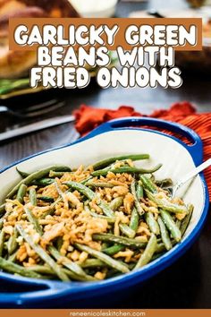 green beans with fried onions in a blue bowl