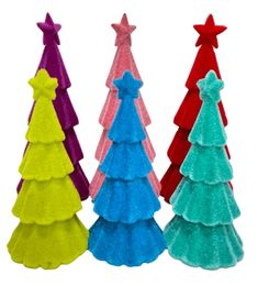 three different colored christmas trees with bows on them