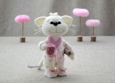 a small white mouse with pink decorations on it's head and legs, holding a coffee cup