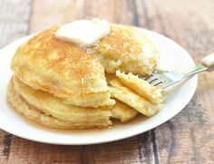 pancakes on a plate with butter and syrup