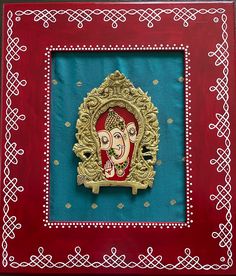 an intricately decorated frame with a painting on it