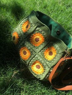 Granny Square Boho Bag, This colorful and stylish crochet boho bag is the perfect accessory for any fashion-forward individual who loves unique and handmade items. It's versatile and functional, serving as summer clutch and handbag to accommodate all your belongings. Measurements: ♥Width: 28 cm ♥Height without handles: 20 cm ♥Total height with handles:39 cm  It has acrylic handle Hand Knitted Rectangular Crochet Bag For Crafting, Bohemian Granny Square Crochet Bag For Crafting, Green Hand-knitted Crochet Tote Bag, Bohemian Green Crochet Bags, Green Crochet Bag With Granny Square For Daily Use, Green Crocheted Yarn Bag, Handmade Green Yarn Crochet Bag, Green Crochet Yarn Bag, Green Crochet Granny Square Bag For Everyday Use