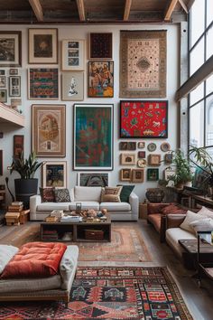 a living room filled with furniture and lots of pictures hanging on the wall above it