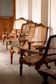 there are many chairs lined up on the floor next to each other in this room