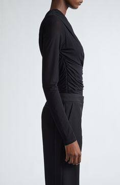 Soft viscose jersey is wrangled by ruching into a simply stunning bodysuit styled with an asymmetric neckline and destined to become a staple pair-with-anything piece. Hidden side-zip closure Asymmetric neck Long sleeves Partially lined 100% viscose Dry clean Imported Designer Clothing Elegant Stretch Bodysuit With Asymmetrical Neckline, Elegant Fitted Bodysuit With Asymmetrical Neckline, Evening Bodysuit With Asymmetrical Neckline, Fitted Bodysuit With Asymmetrical Neckline For Evening, Elegant Evening Bodysuit In Elastane, Asymmetrical Stretch Bodysuit For Evening, Elegant Ruched Bodysuit For Party, Chic Evening Bodysuit With Asymmetrical Neckline, Chic Fitted Ruched Bodysuit