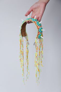 Colorful beaded headband with free falling tassels made of gemstone and glass beads. Unique and one of a kind jewelry design. From 2016 jewelry collection. Headband was made of: Crystal glass beads. Seed beads. White quartz beads. Animal friendly fabric on the back, gentle to the skin. FREE SHIPPING. We offer fast shipping. Europe 1 - 2 days after dispatch. Word wide 2 - 5 days after dispatch. CUSTOM ORDERS. I love doing custom orders! Please contact me with your requests. Special orders are pri Nature-inspired Beaded Jewelry For Festivals, Adjustable Embellished Festival Headpieces, Festival Adjustable Embellished Headpieces, Multicolor Festival Headpieces For Summer, Multicolor Beads With Bead Caps For Festivals, Beaded Festival Headband, Beaded Headband For Festivals, Whimsical Multicolor Adjustable Headpieces, Bohemian Beaded Headpiece For Festivals