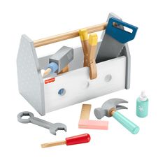 a toy toolbox with tools in it on a white surface, including hammers and wrenches