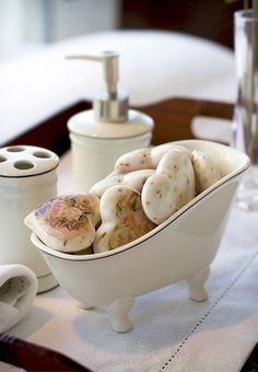 a white bowl filled with lots of food on top of a table