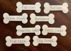 six dog bone magnets with names on them