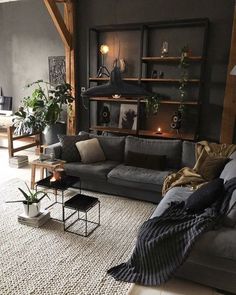 a living room filled with lots of furniture and plants on top of it's shelves