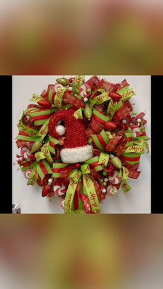 a christmas wreath with a santa hat on it