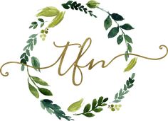 the word tfn surrounded by green leaves and branches in a circle with gold lettering