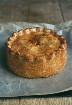 a pie sitting on top of a piece of wax paper