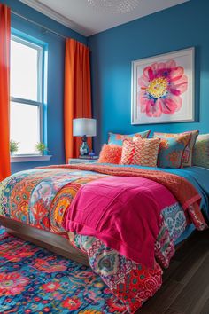 a bedroom with blue walls, orange curtains and a colorful comforter on the bed