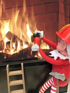 an elf is cleaning the fire place with a brush